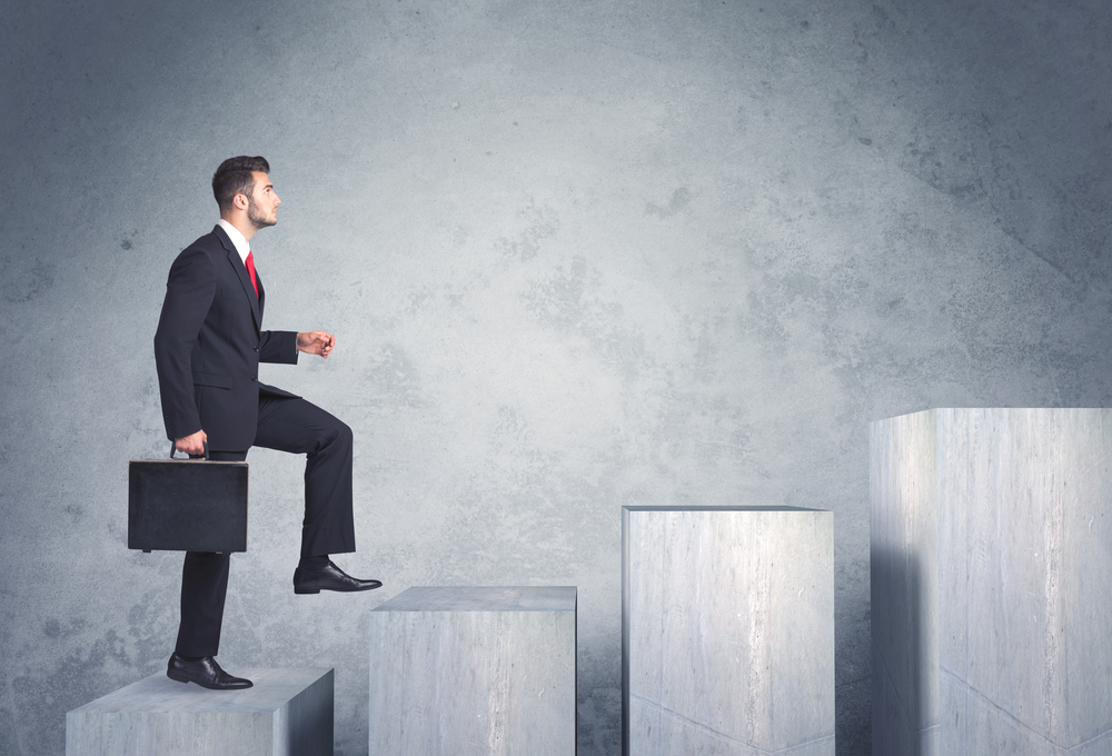Business person stepping up a staircase-1 Business person stepping up a staircase-1